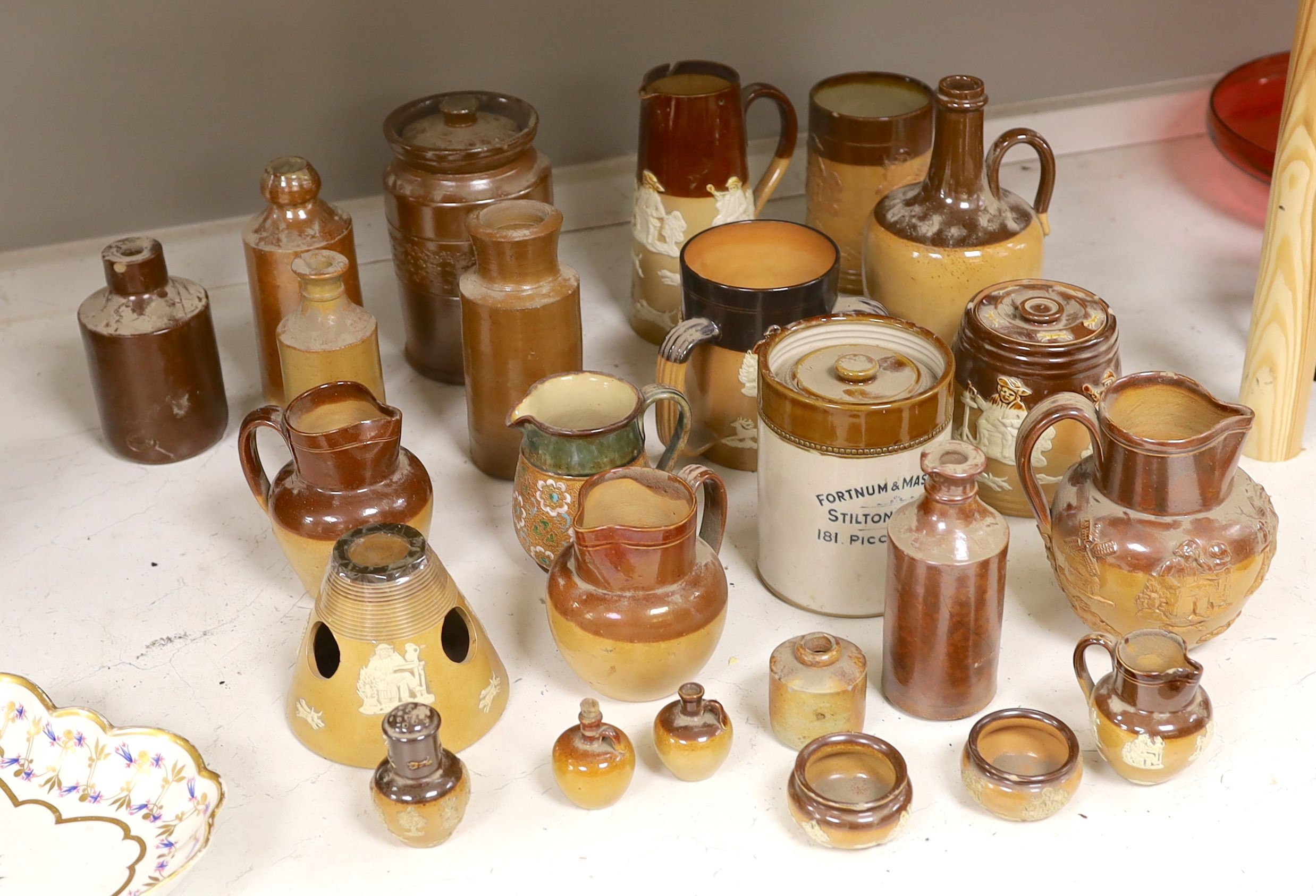 A quantity of Doulton stonewares including inkstand, jug, miniature salts and 19th century saltglaze pottery bottles, tallest item large jug 18 cms high.